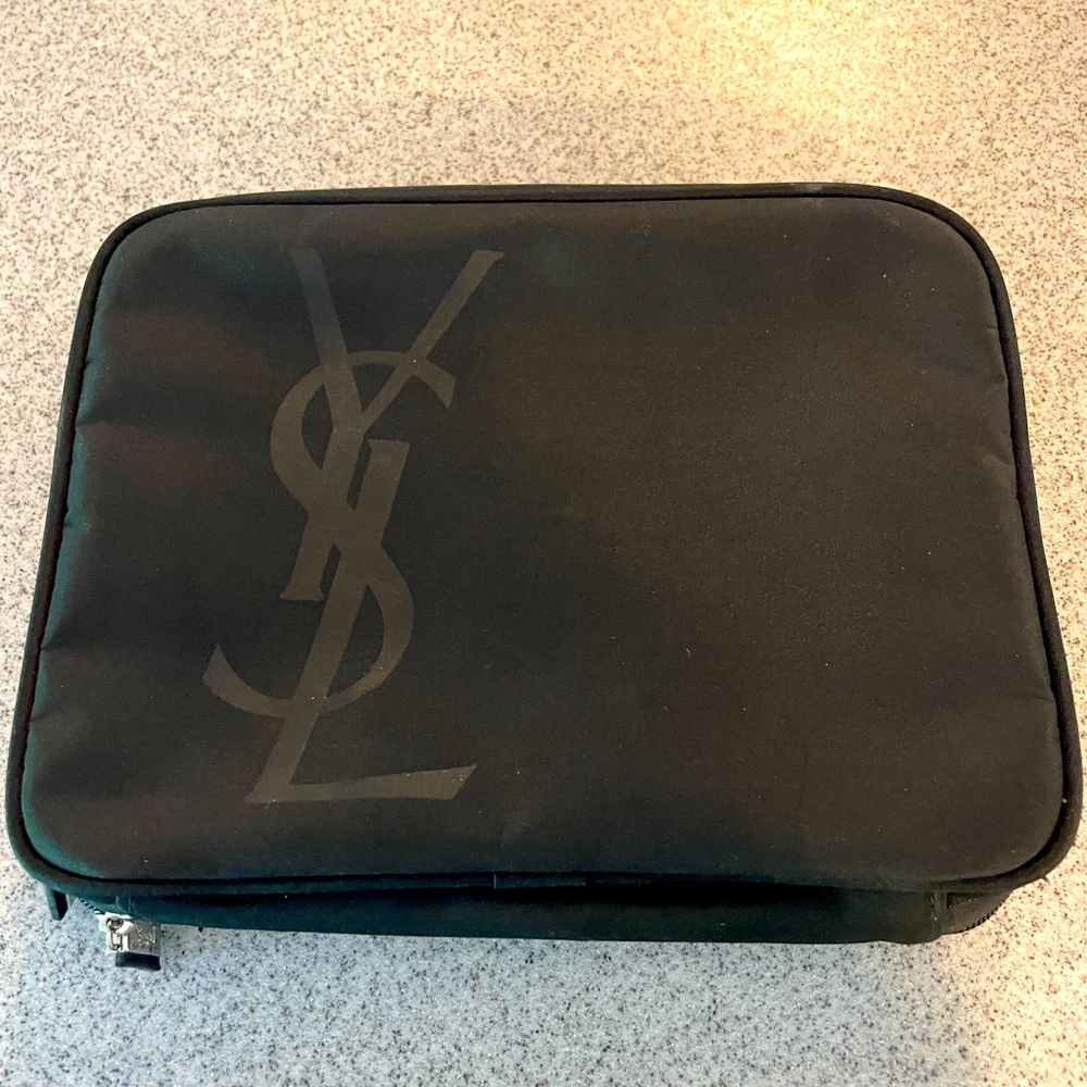 Yves Saint Laurent makeup case. Black and clear.